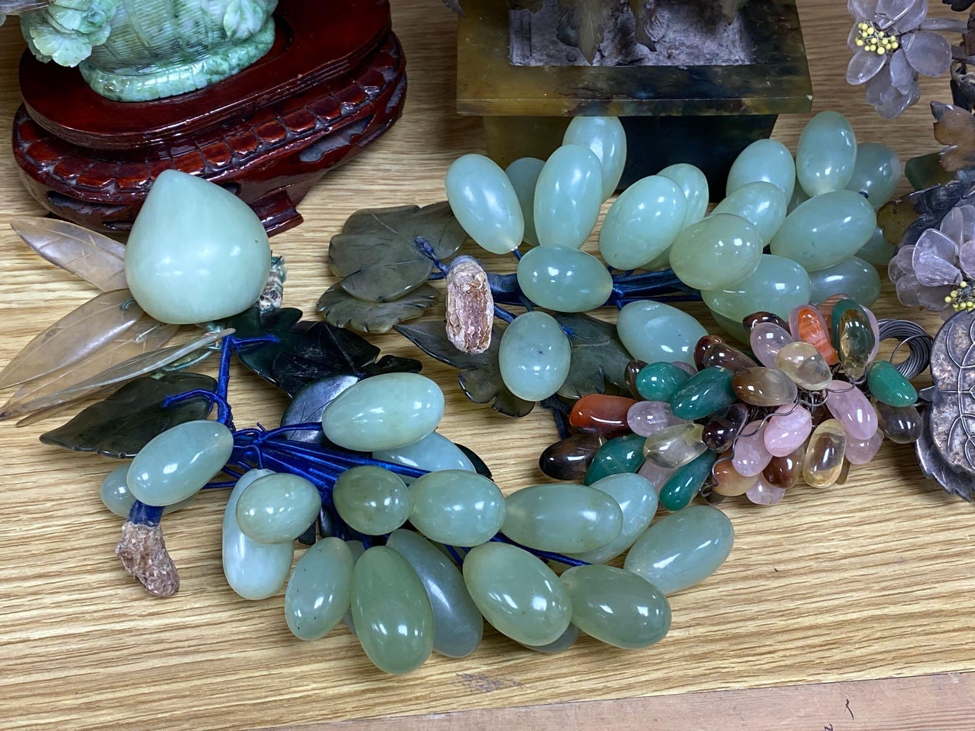 A group of hardstone grapes and floral displays and jadeite carvings